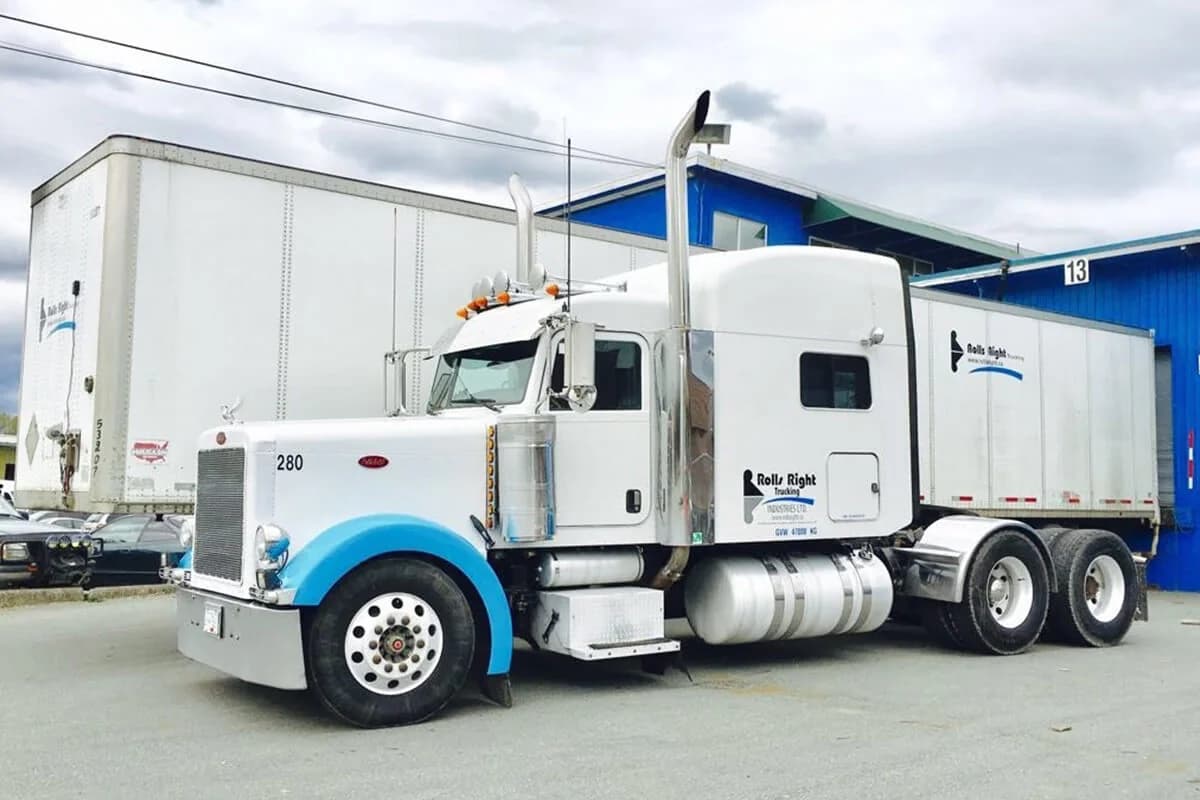 Rolls Right Peterbilt tractor, unit 280, with a dry van trailer