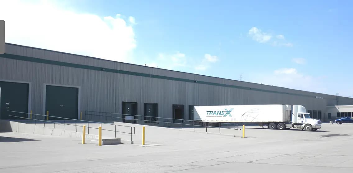 Warehouse dock court with a trailer at the doors