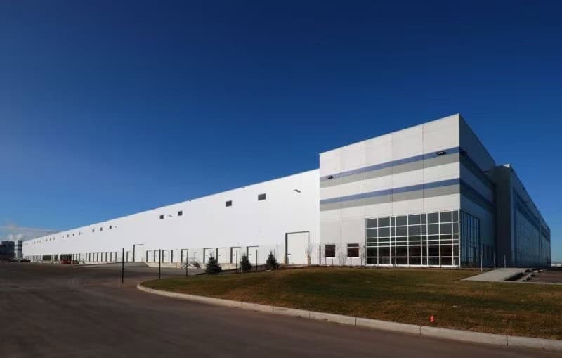 Modern warehouse building with a long dock wall